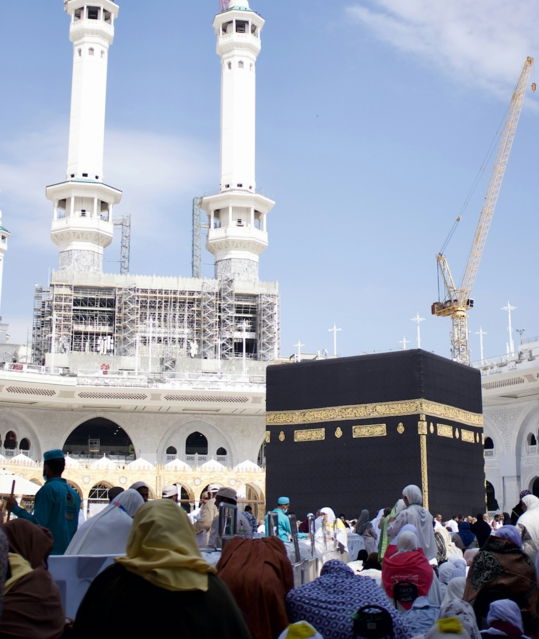 a-group-of-people-standing-in-front-of-a-building.jpg A group of people standing in front of a building