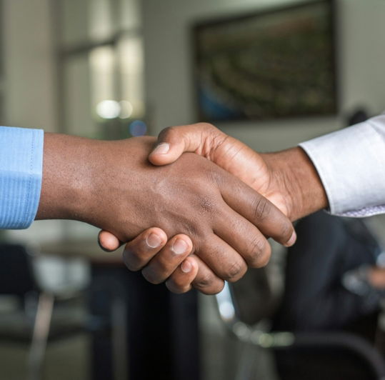 two-people-shaking-hands.jpg two people shaking hands